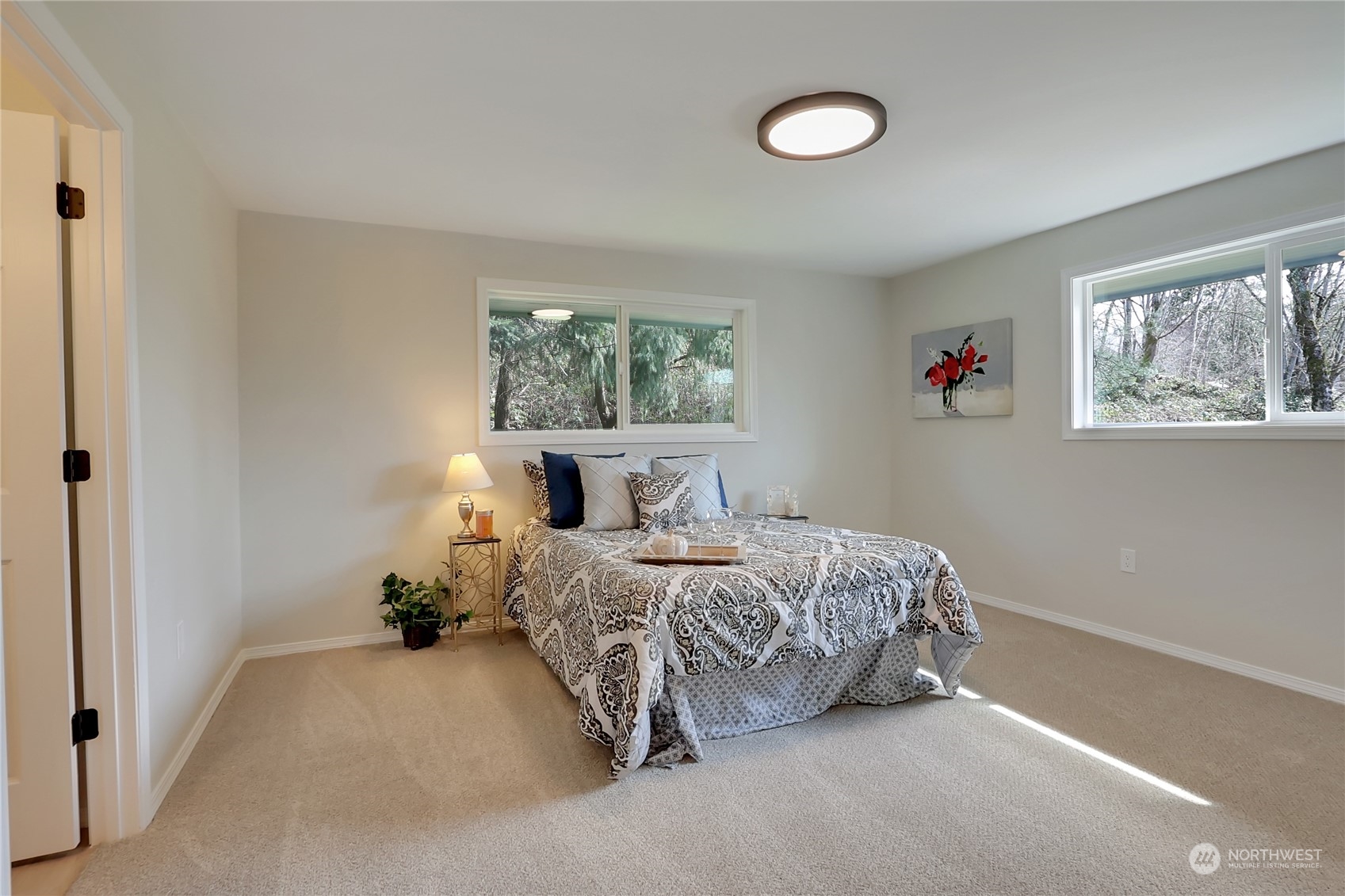 3400 Talbot Road South Renton, WA 98055 - Photo 12 of 35 a bedroom with bed and a window