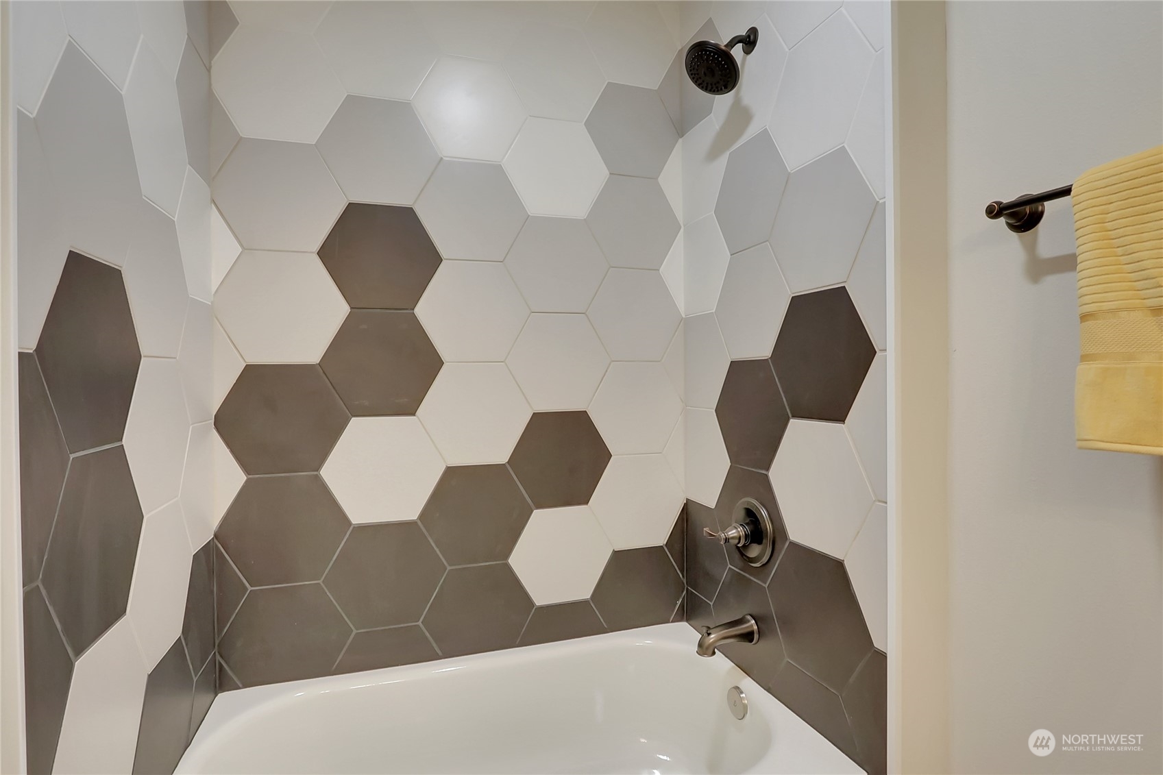 3400 Talbot Road South Renton, WA 98055 - Photo 17 of 35 a bathroom with a bathtub and mirror