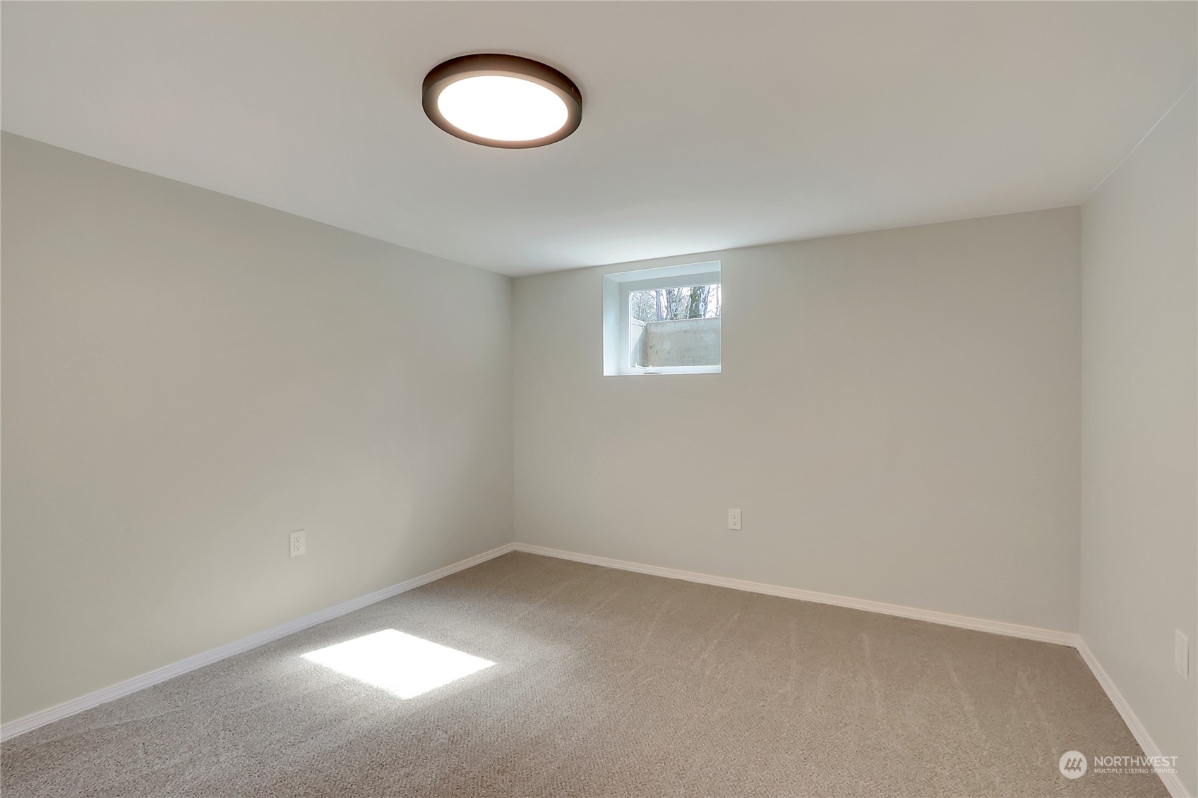3400 Talbot Road South Renton, WA 98055 - Photo 21 of 35 an empty room with a window