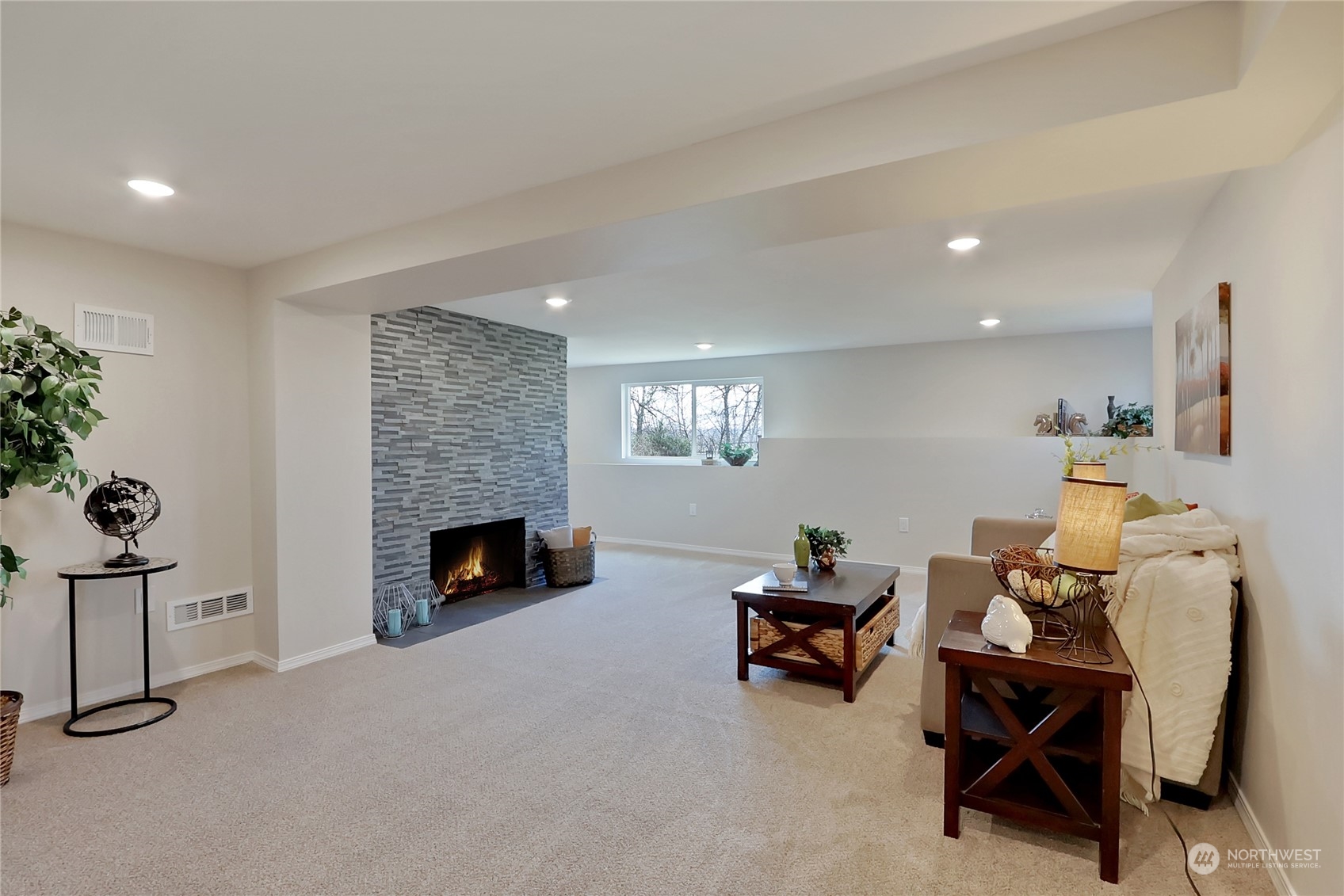 3400 Talbot Road South Renton, WA 98055 - Photo 24 of 35 a living room with furniture and a fireplace