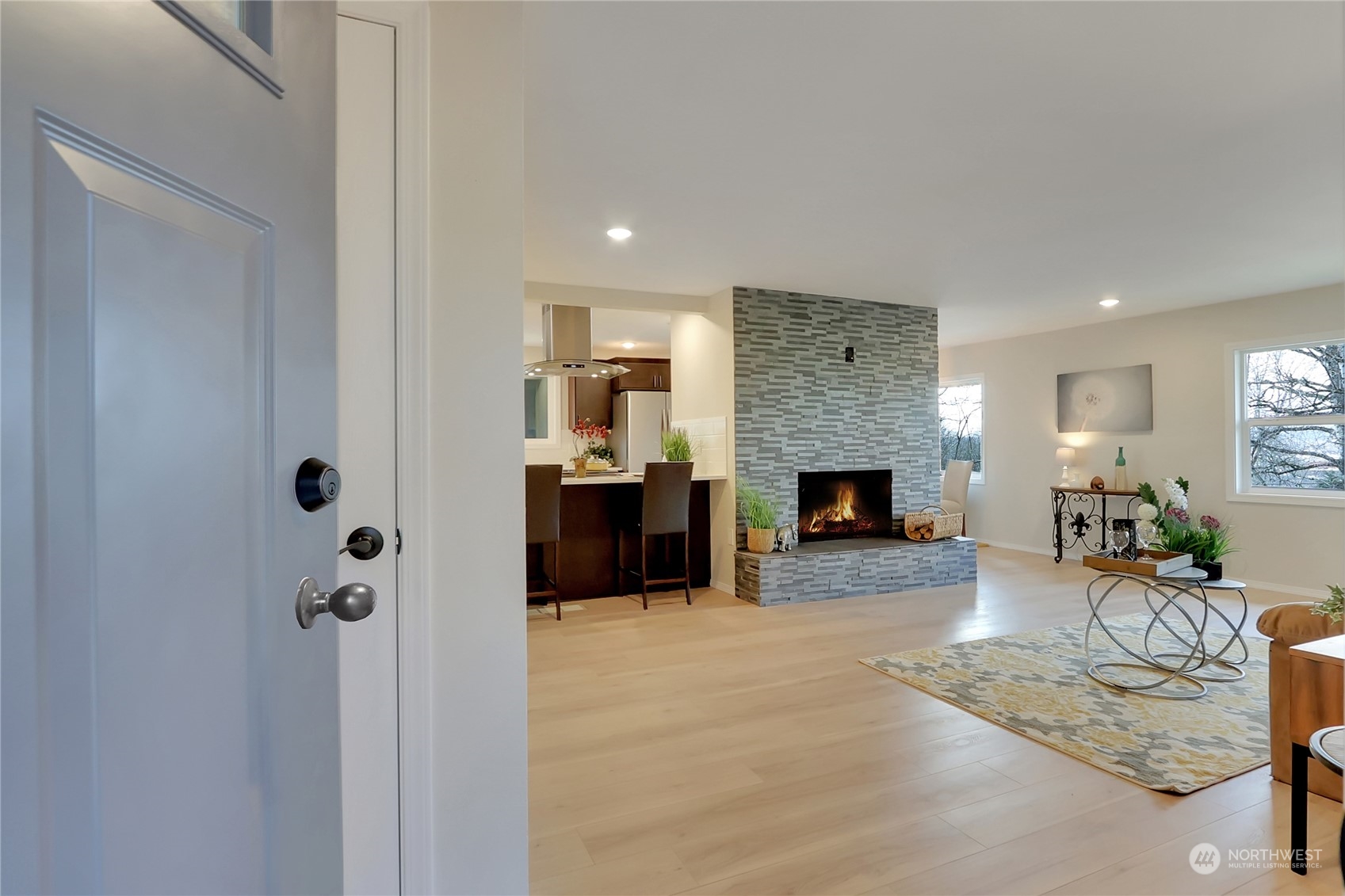 3400 Talbot Road South Renton, WA 98055 - Photo 4 of 35 a living room with furniture and a fireplace