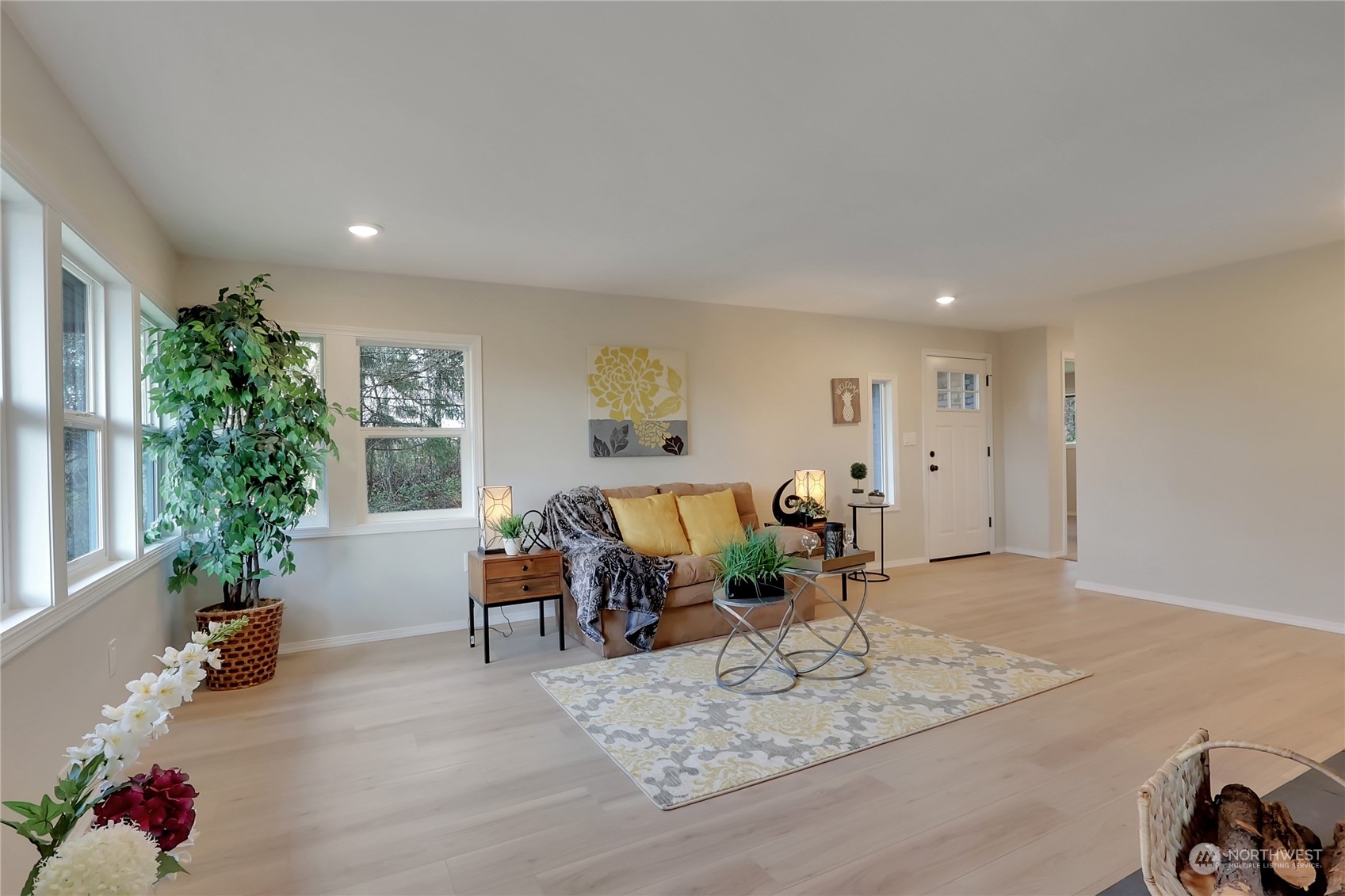 3400 Talbot Road South Renton, WA 98055 - Photo 5 of 35 a living room with furniture hard wood floor and a potted plant