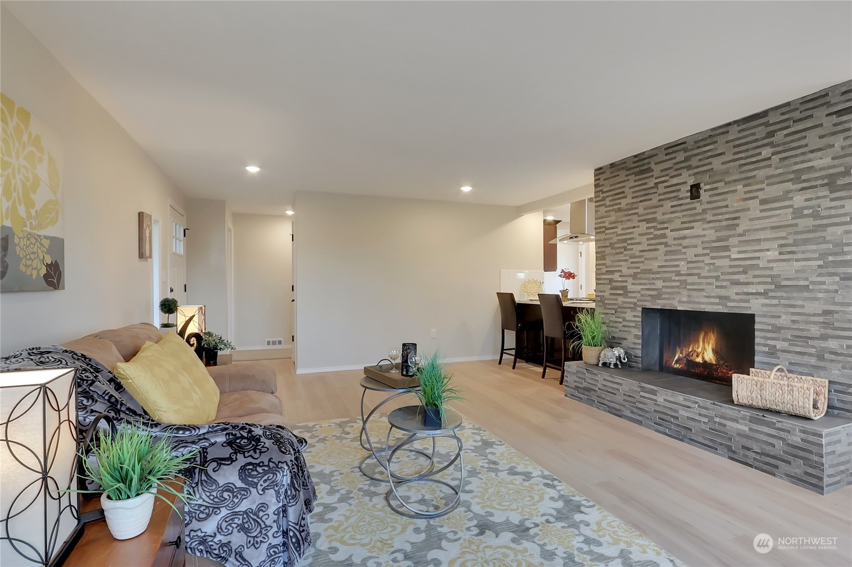 3400 Talbot Road South Renton, WA 98055 - Photo 6 of 35 a living room with furniture and a fireplace