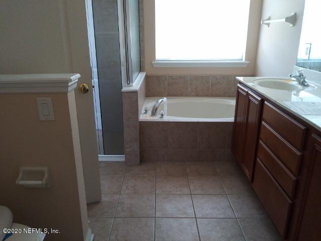 3045 Captiva Bluff Circle Jacksonville, FL 32226 - Photo 6 of 10 a bathroom with a bathtub sink and toilet