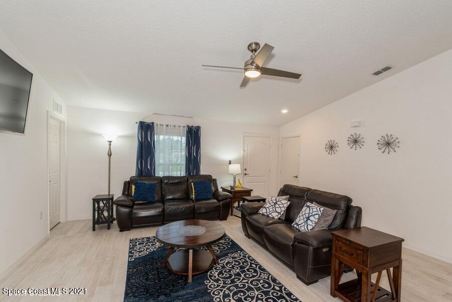 987 Raleigh Road Southeast Palm Bay, FL 32909 - Photo 3 of 22 03_987RaleighRd_1_LivingRoom_LowRes