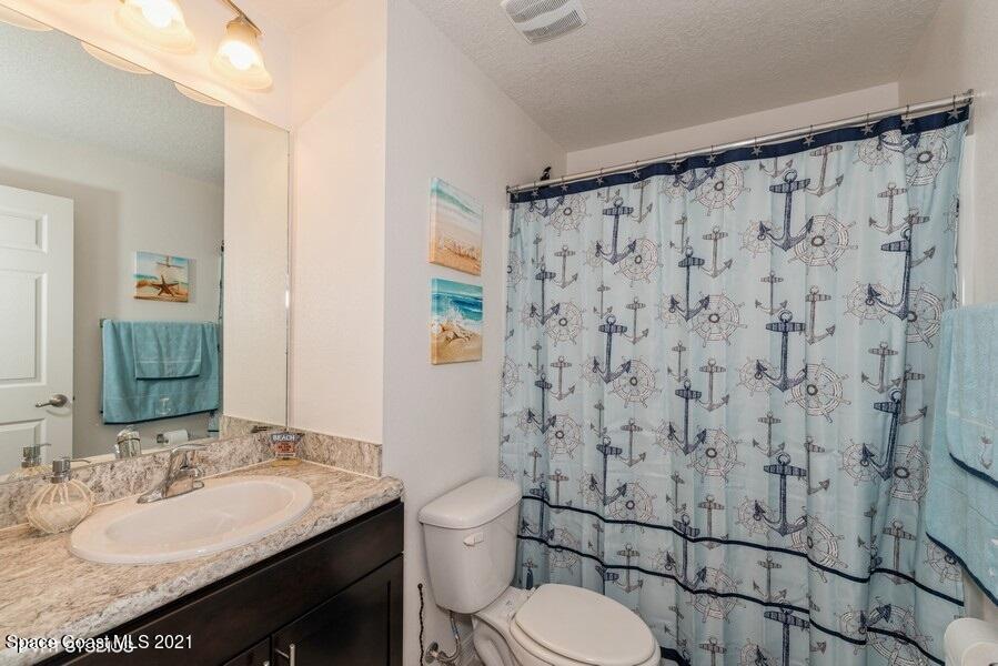 987 Raleigh Road Southeast Palm Bay, FL 32909 - Photo 10 of 22 10_987RaleighRd_8_Bathroom_LowRes