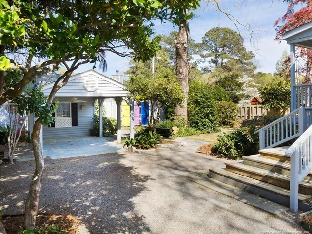 a view of a porch with potted plants