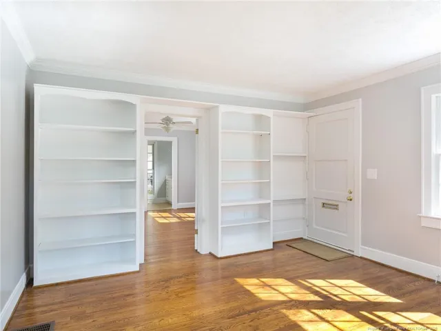 a view of an empty room with empty shelves