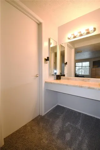 a bathroom with a bathtub and a sink