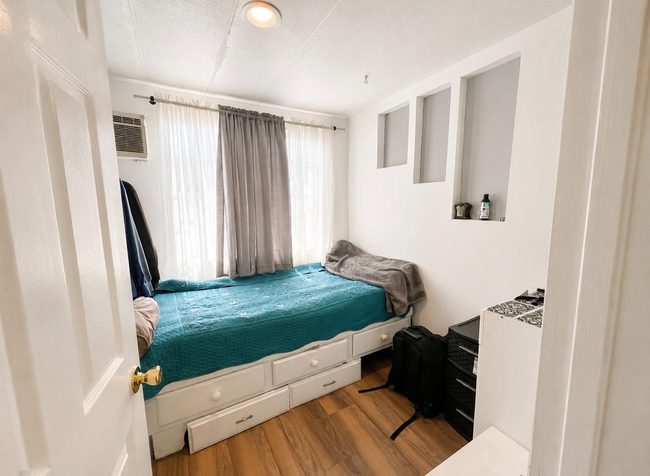 5000 Pierce Road, Unit 32 Bakersfield, CA 93308 - Photo 7 of 15 a bedroom with a bed and a window