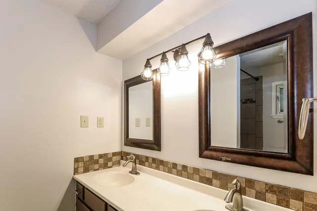 a view of a livingroom with wooden floor and a window