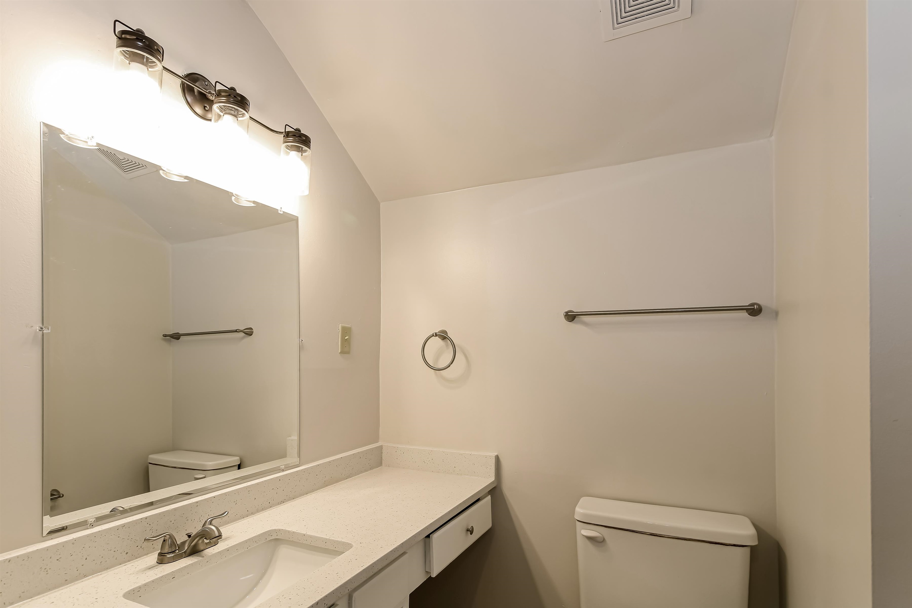 8661 Roundtree Place Memphis, TN 38016 - Photo 12 of 17 a bathroom with a sink a toilet and shower