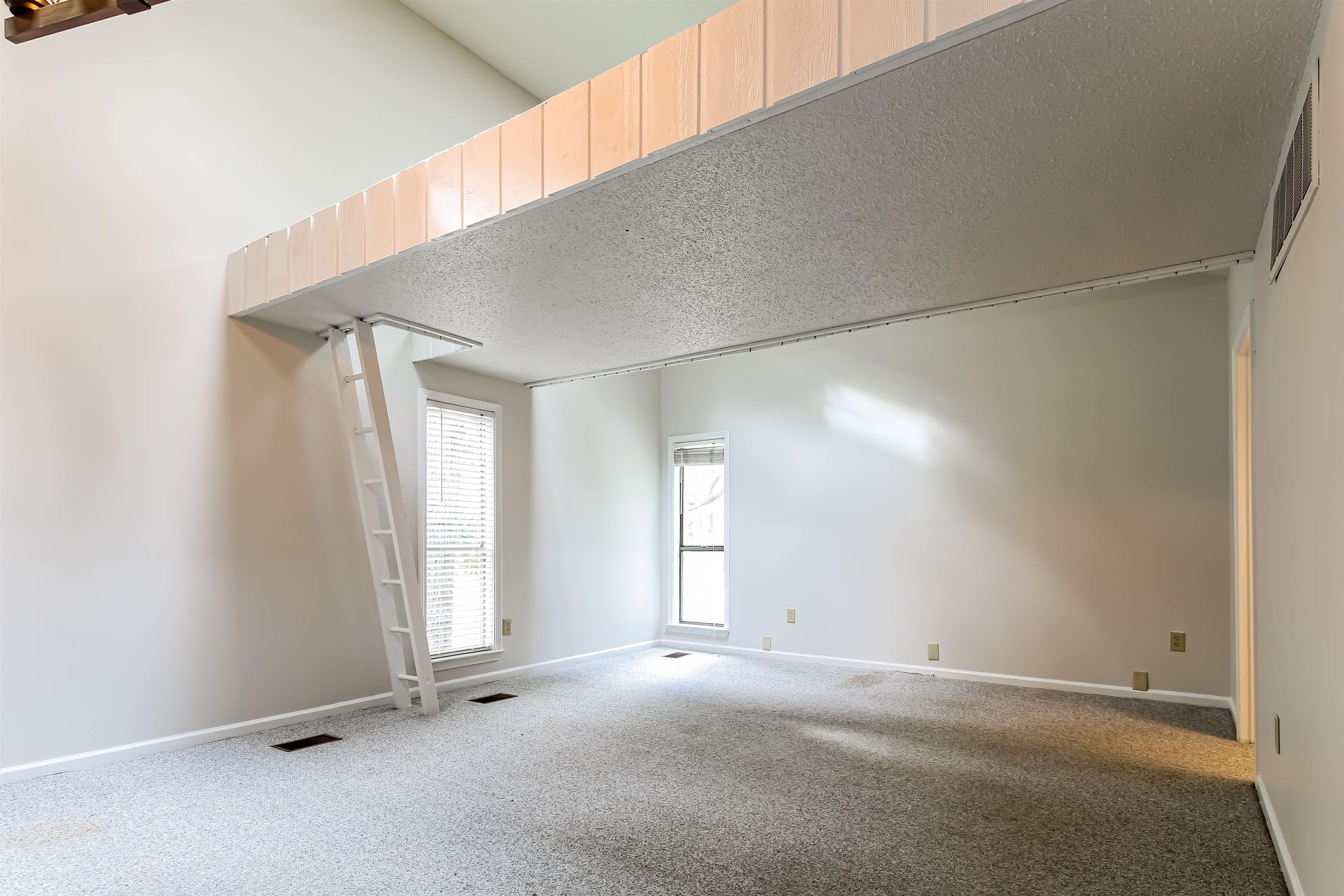 8661 Roundtree Place Memphis, TN 38016 - Photo 3 of 17 an empty room with windows
