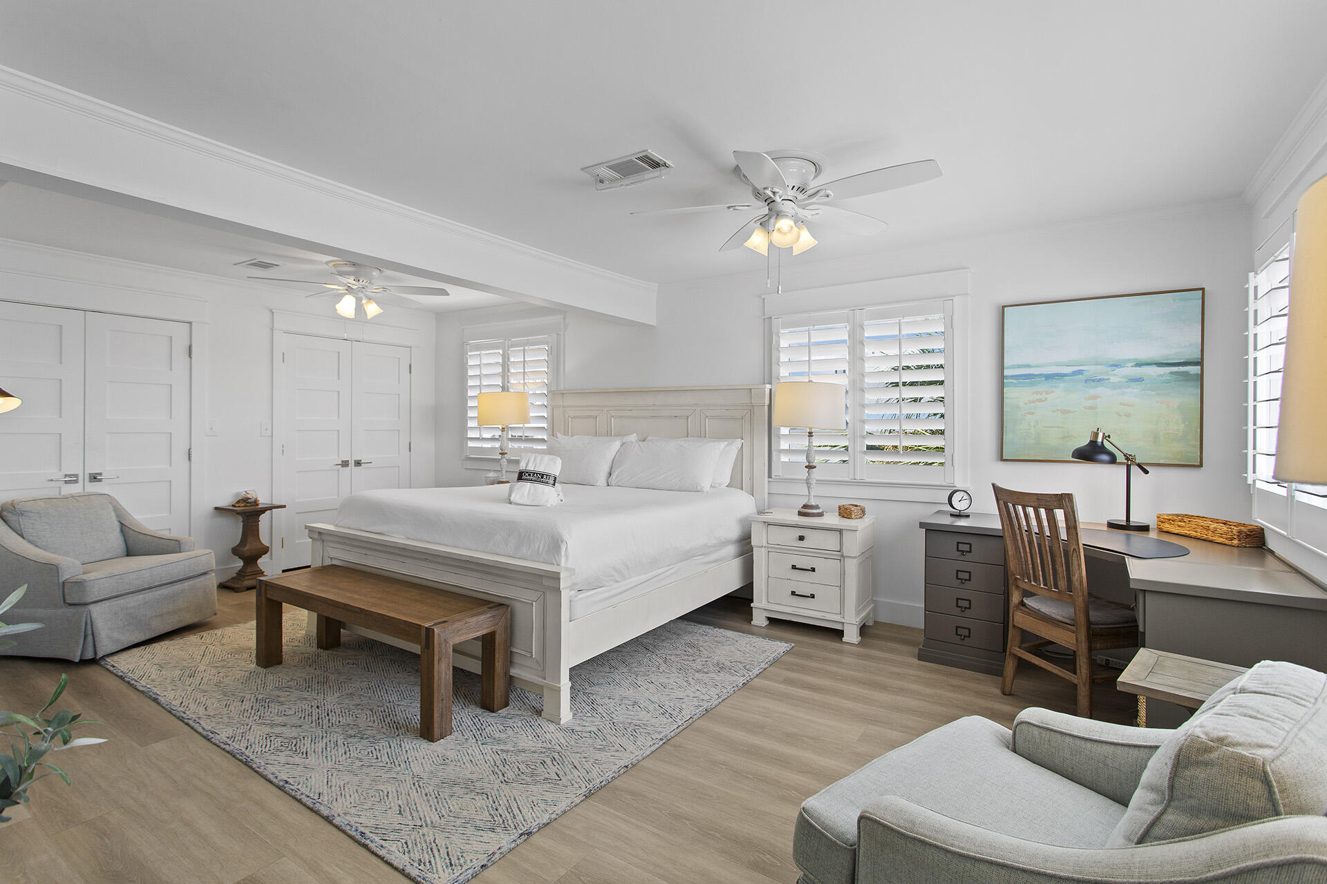 448 West Park Pl Avenue, Unit A1 Inlet Beach, FL 32461 - Photo 11 of 34 a spacious bedroom with a bed a couch and a chandelier