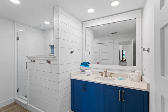 a bathroom with a sink double vanity and a mirror