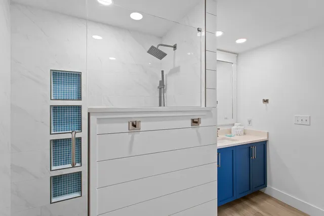 a bathroom with a sink and mirror