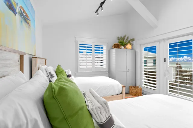 a bedroom with a bed and a chair