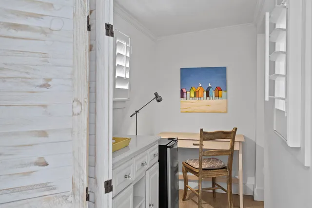 a view of hallway with seating area