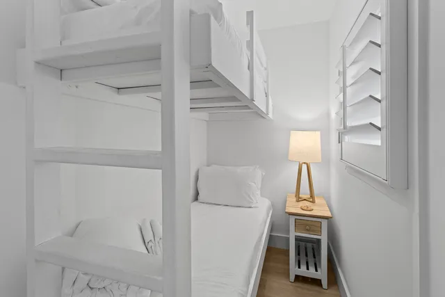 a view of storage and utility room with wooden floor