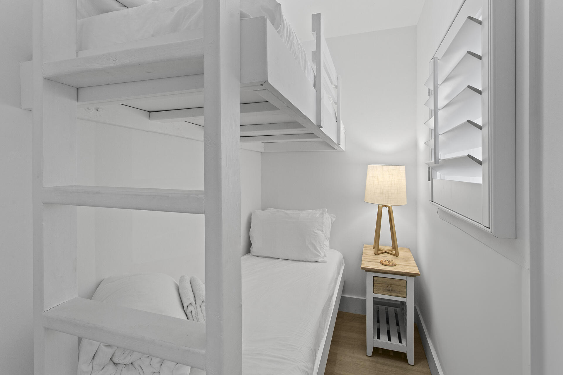 448 West Park Pl Avenue, Unit A1 Inlet Beach, FL 32461 - Photo 18 of 34 a view of storage and utility room with wooden floor