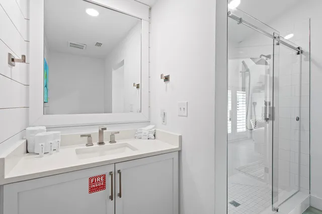 a bathroom with a sink vanity and a mirror