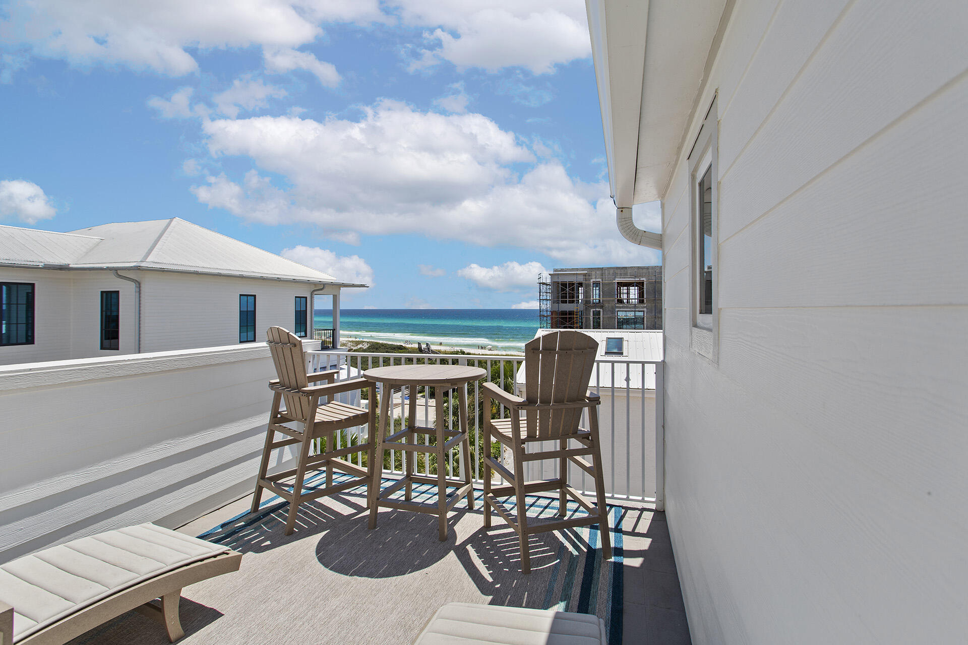 448 West Park Pl Avenue, Unit A1 Inlet Beach, FL 32461 - Photo 23 of 34 a view of a patio with table and chairs with wooden floor