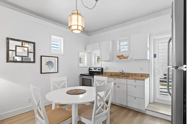a view of kitchen with cabinets and wooden floor