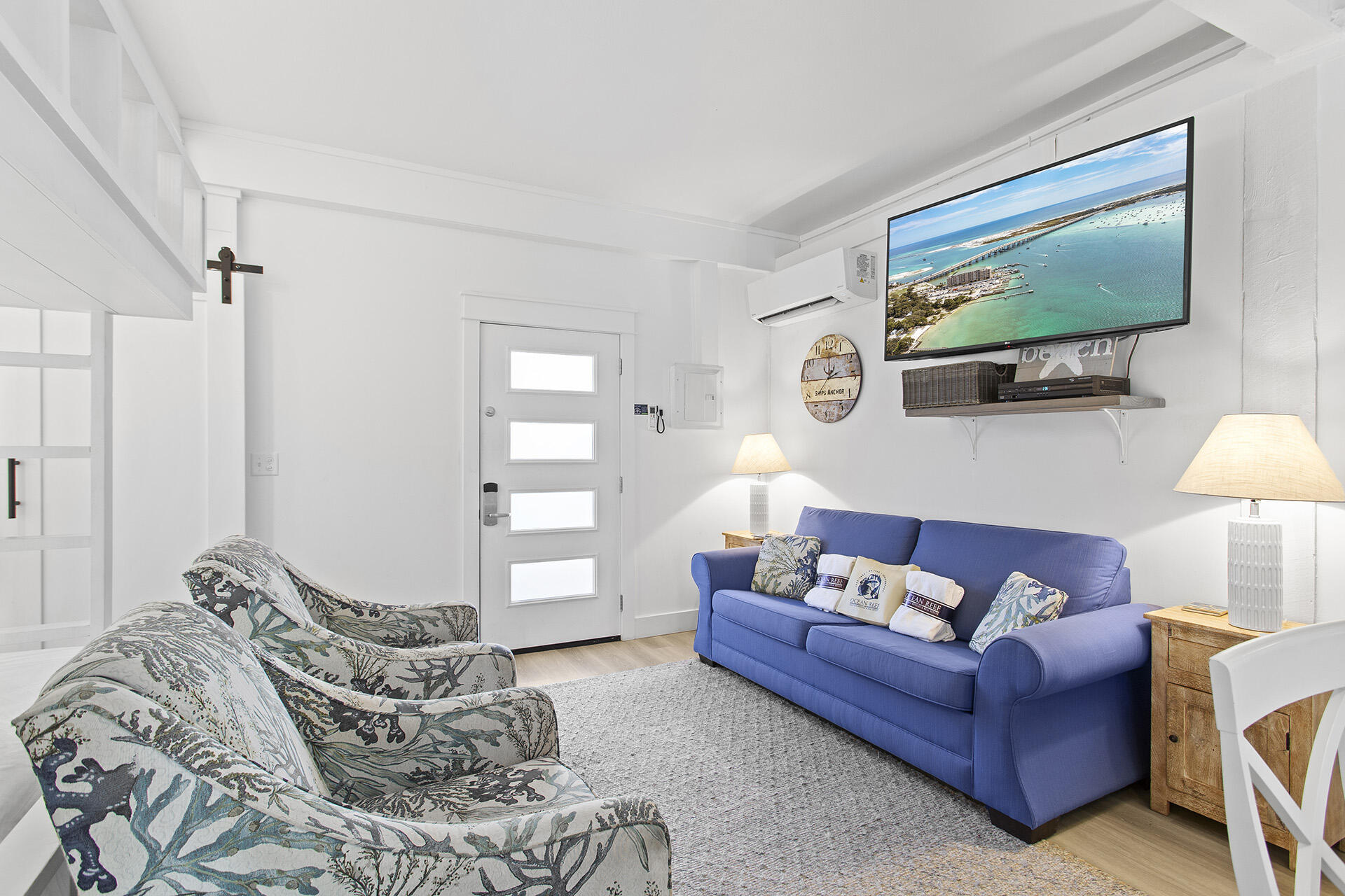 448 West Park Pl Avenue, Unit A1 Inlet Beach, FL 32461 - Photo 27 of 34 a living room with furniture and a flat screen tv