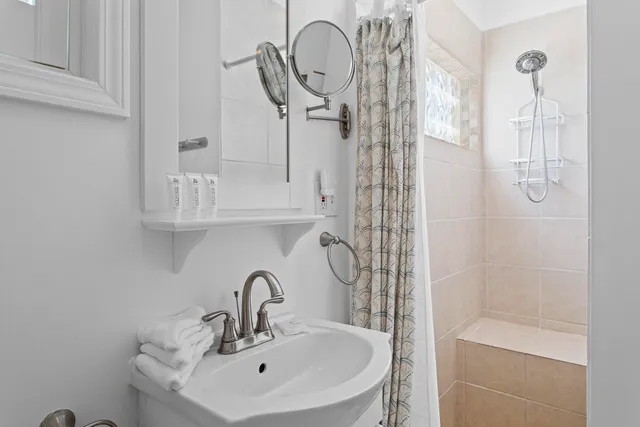 a bathroom with a sink and a mirror