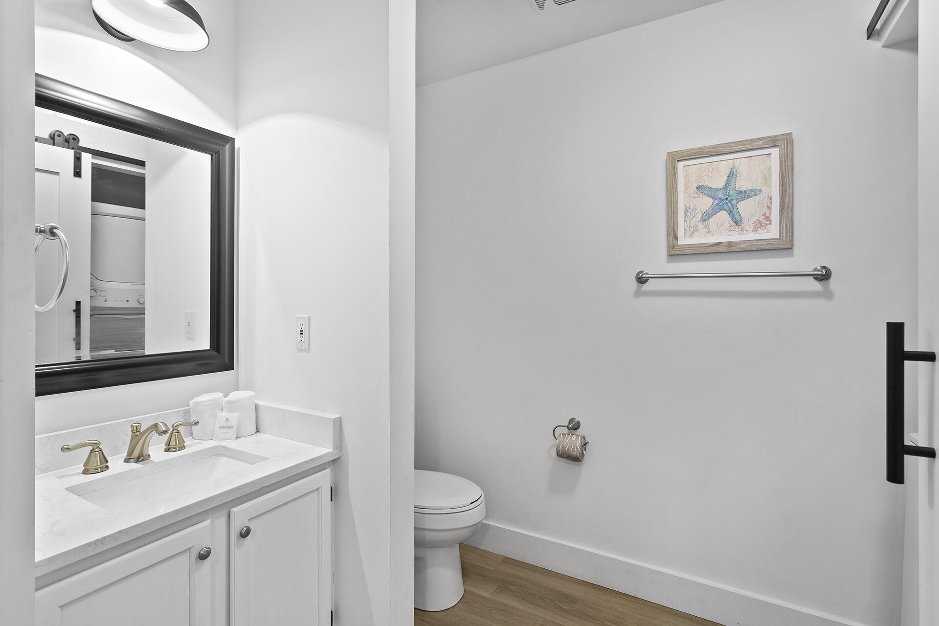 448 West Park Pl Avenue, Unit A1 Inlet Beach, FL 32461 - Photo 30 of 34 a bathroom with a granite countertop sink mirror and toilet