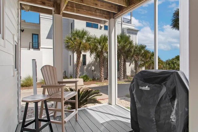 a view of a balcony with chairs