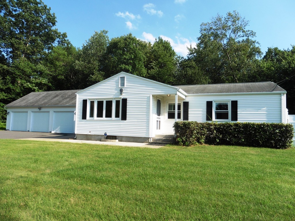 131 Sunbrier Road Springfield, MA 01129 - Photo 1 of 22 a front view of a house with a garden