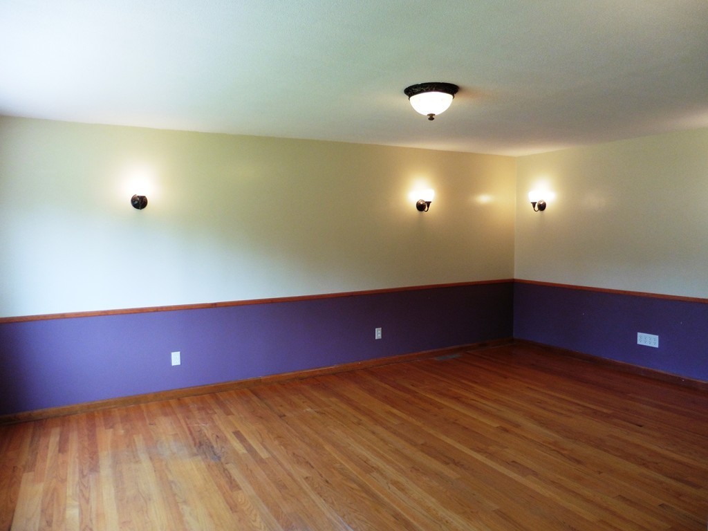 131 Sunbrier Road Springfield, MA 01129 - Photo 3 of 22 an empty room with wooden floor and windows