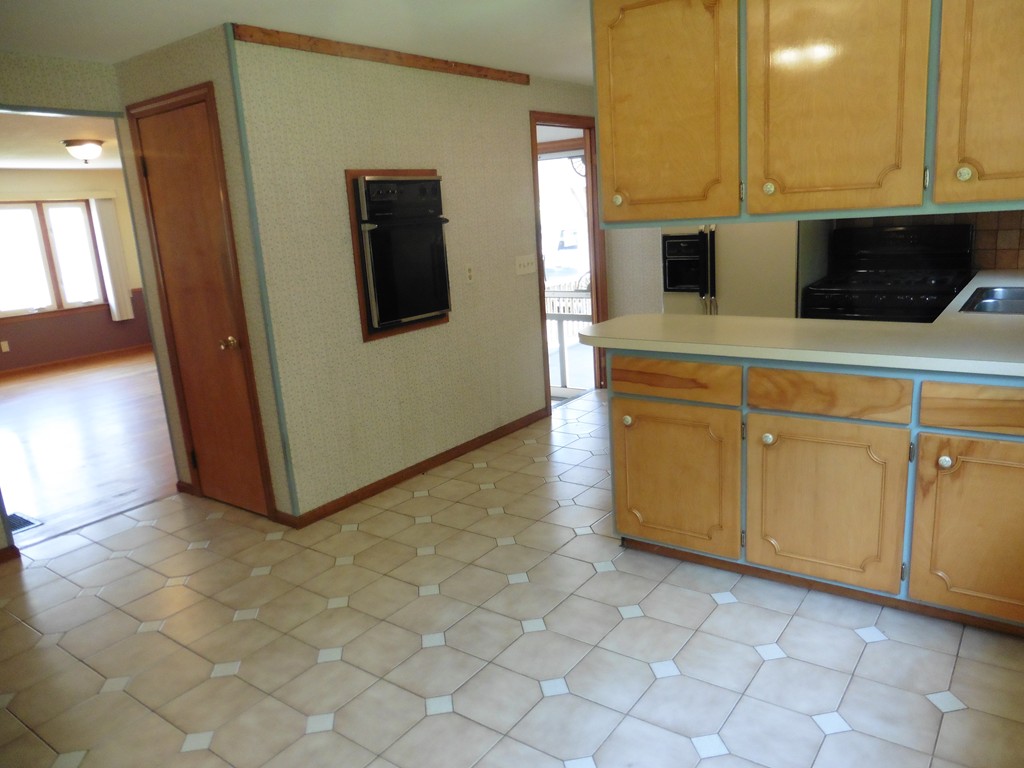 131 Sunbrier Road Springfield, MA 01129 - Photo 6 of 22 a kitchen with granite countertop a sink a stove and cabinets