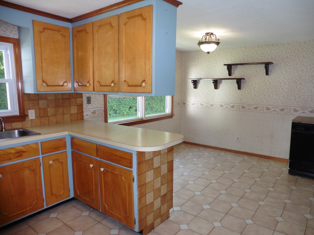 131 Sunbrier Road Springfield, MA 01129 - Photo 7 of 22 a kitchen with a sink cabinets and window