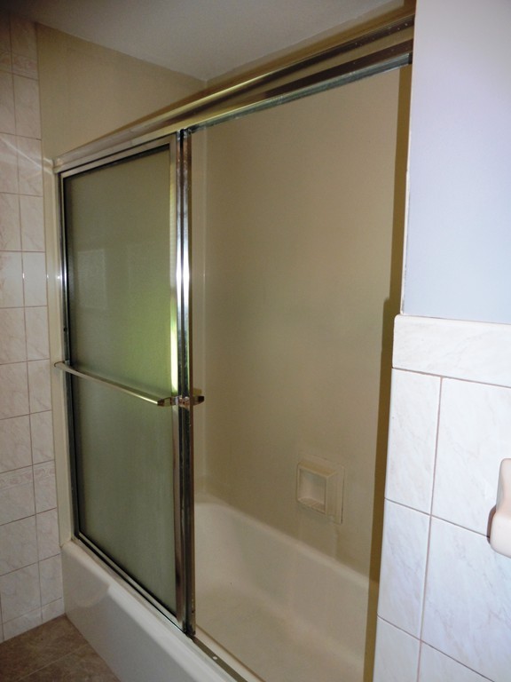 131 Sunbrier Road Springfield, MA 01129 - Photo 10 of 22 a bathroom with a glass shower door