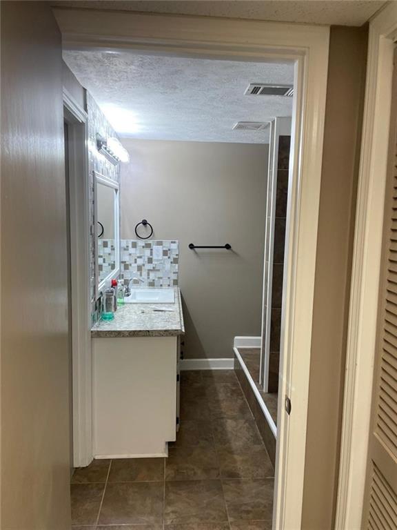 Undisclosed Address Lawrenceville, GA 30043 - Photo 4 of 5 a bathroom with a sink and mirror