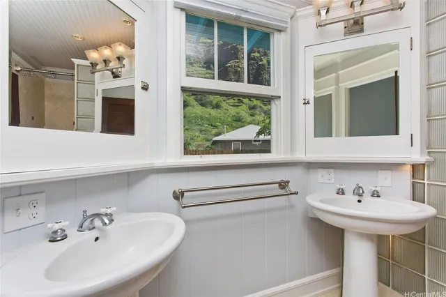 a bathroom with a sink and a window