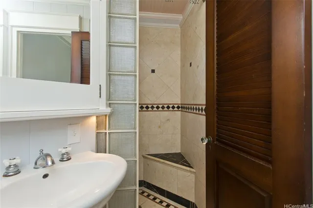 a bathroom with a sink and mirror