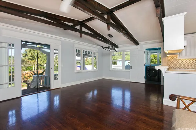 a view of an entryway with wooden floor and windows