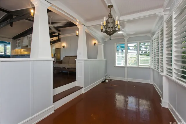 a view of a livingroom with a ceiling fan and window