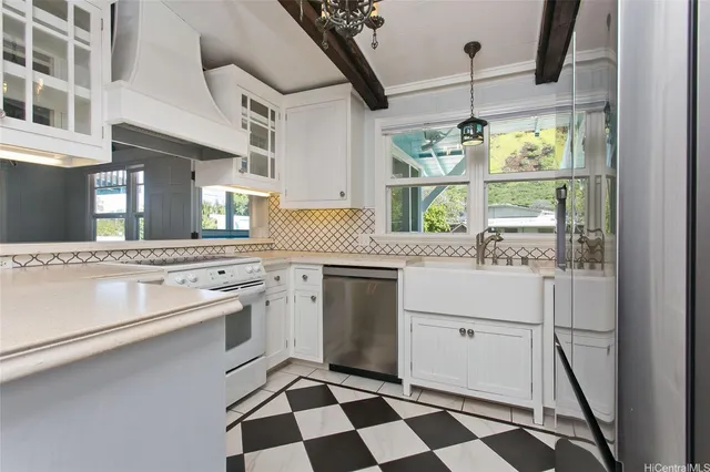 a kitchen with a stove a sink and a refrigerator