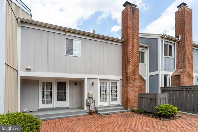 a view of a grassy field with trees
