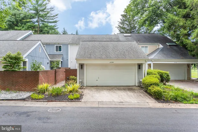 a utility room with stainless steel appliances granite countertop a sink stove and refrigerator