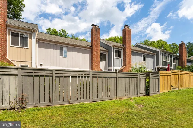 a kitchen with stainless steel appliances granite countertop a sink a stove and island with granite countertops
