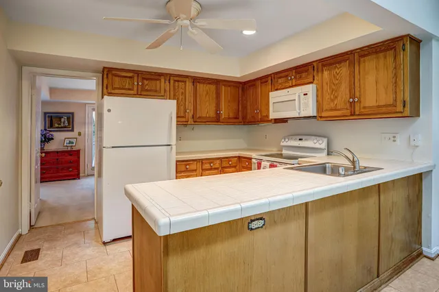 a bedroom with a bed and a dresser in it