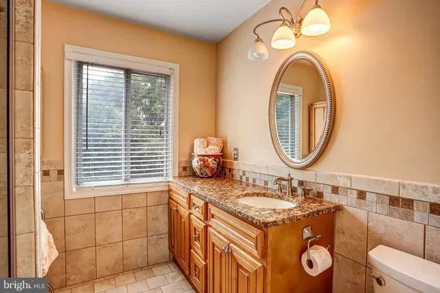 a front view of a house with a patio and a yard