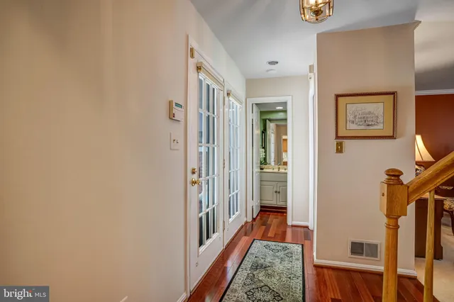 a living room with fireplace furniture and a large window