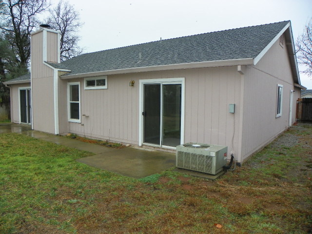 710 Mallard Street Redding, CA 96003 - Photo 18 of 19 a backyard of a house with seating space
