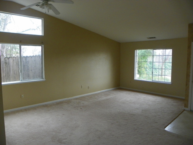 710 Mallard Street Redding, CA 96003 - Photo 4 of 19 an empty room with windows